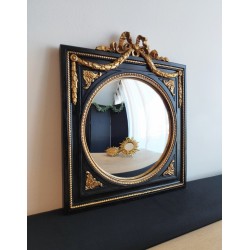 Miroir de sorcière dans cadre noir et détails or style empire