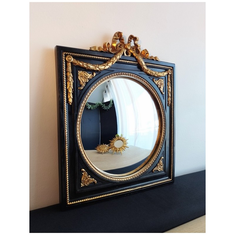 Miroir de sorcière dans cadre noir et détails or style empire