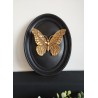 Cadre médaillon papillon noir et or