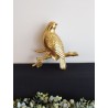 Décoration murale oiseau posé sur sa branche doré